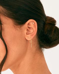 These minimalist bar threader earrings for women can be worn in multiple ways: let them dangle freely or wrap around your second piercing! These timeless dangle earrings are plated for a long-lasting finish that is nickel free, lead-free, and hypoallergenic. Description: Measurements: Chain Length: 2.4" (60mm); Thickness: 0.95mm; Horizontal Bar: 1.5x10mm 925 Sterling Silver Post. 14K yellow gold or Rhodium plated. Delicate Threader Earrings With Adjustable Chain, Dainty Threader Earrings With Adjustable Chain, Dainty Everyday Threader Earrings, Minimalist Linear Earrings, Dainty Dangle Ear Cuff, Minimalist Dangle Threader Earrings, Everyday Delicate Chain Threader Earrings, Everyday Delicate Chain Linear Earrings, Everyday Linear Earrings With Delicate Chain