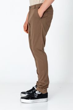 Elevate your everyday style with our men's casual wear pants, designed for both comfort and convenience. With a classic design featuring straight or tapered legs, they boast details like belt loops, pockets, and a zip fly with button closure for timeless appeal. Whether you're running errands or heading to a casual outing, these pants effortlessly adapt to any occasion. Versatile and stylish, they pair seamlessly with a range of tops, allowing you to create effortlessly put-together looks with e Men's Casual Wear, Mens Pants Fashion, Leather Pieces, Wool Suit, Suit Shop, Jacket Buttons, Knit Jacket, Everyday Style, Men's Casual