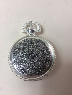 Welcome to my shop.  For sale is this wonderful vintage Sorge chrome and steel pocket-watch/fob-watch. The cover of the watch has a lovely design and the back of the watch is a see-through skeleton view. It measures 2 inches in diameter. This would make a lovely gift for the collector, or for yourself! Should you buy more than one item I'm also happy to combine the shipping cost.  Please have a look at my other items in my shop. BestFrenchBargains Best French bargains does not accept cancellations on any orders so please make sure you are committed  to your purchase before placing a order all returns shipping charges are at the buyers expense and refunds for the original shipping is also at the buyers expense all items must be returned within 14 days in the original packaging and must be s Vintage Pocket Watch With Metal Dial Gift, Vintage Metal Pocket Watch Engraved, Vintage Metal Engraved Pocket Watch, Vintage Engraved Metal Pocket Watch, Vintage Pocket Watch With Compass Design, Vintage Engraved Pocket Watch For Gift, Vintage Silver Pocket Watch With Metal Dial, Vintage Pocket Watch With Metal Dial, Vintage Metal Pocket Watch Nickel Free