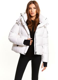 This cropped puffer jacket is crafted from a densely woven nylon yarn, and filled with down to achieve warmth and an ultra soft feel. It is lightweight, wind resistant, and water-repellent. The Jordy features a stand collar, a detachable zip off hood, spandex wrist cuffs with thumbholes, center front zip and snap placket closure, and lower zip pockets. North Face Nuptse, Cropped Puffer Jacket, 1 Girl, Wrist Cuffs, Sherpa Jacket, Down Parka, A Stand, Feel It, Human Rights