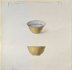 two bowls sitting on top of each other in the middle of a white background with gold trim