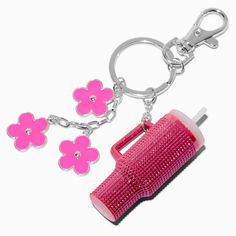 a pink hair dryer keychain with flowers on the side and two clips attached to it