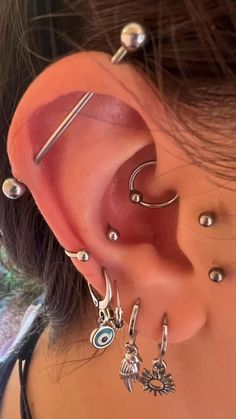 a woman with piercings on her ear