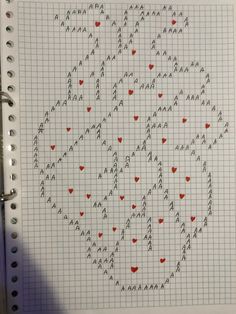 a spiral notebook with hearts drawn on it