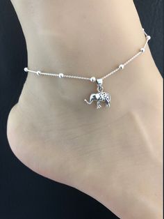 "Sterling Silver Tiny Elephant Anklet Minimalist and Dainty Rolo Beaded Tiny Elephant Anklet ANKLET FEATURES: Metal: All components are made from solid .925 Sterling Silver Model is wearing 10\" in length solid .925 Sterling Silver Rolo Bead Chain Chain Length: 9 inch + 1 inch extension Your Dainty Rolo Beaded Tiny Elephant Anklet will arrive in a gift box, beautifully wrapped and ready for gifting Please send me a message if you have any questions before or after placing your order. Please also Elephant Anklet, Anklet Chain, Beaded Ankle Bracelets, Silver Model, Beautiful Anklet, Tiny Elephant, Beaded Ankle, Elephant Jewelry, Fire Opal Necklace