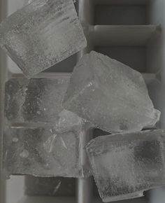 some ice cubes sitting on top of each other in an ice block box,