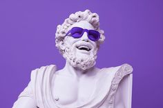 a white statue with purple sunglasses on it's head and beard wearing a roman costume