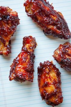 several pieces of chicken sitting on top of a piece of paper