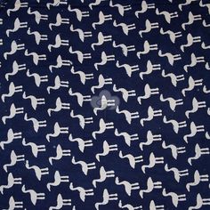 a blue and white fabric with birds printed on the front, in an allover pattern