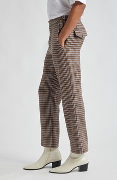 Inspired by 1950s men's suiting, these trousers reproduced the vintage silhouette in merino wool herringbone patterned in brown-and-black checks. 28" inseam; 17" leg opening; 11 1/2" front rise; 17 1/2" back rise (size 32) Zip fly with button-tab closure Front slant pockets; back button-flap pockets Adjustable buckle waist tabs 100% merino wool Dry clean Made in France Designer Clothing Tweed Business Bottoms With Welt Pockets, Brown Wool Dress Pants For Work, Brown Wool Straight Pants, Brown Wool Pants For Business Casual, Brown Business Dress Pants With Welt Pockets, Tweed Bottoms With Welt Pockets For Workwear, Business Brown Bottoms With Welt Pockets, Brown Dress Pants With Straight Hem For Business, Brown Wool Business Pants