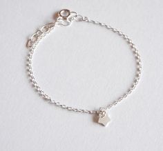 This cute and minimalist silver star bracelet would be a precious gift for a new baby, first birthday, baptism, children gift, or any occasions. This tiny & adorable bracelet is made with sterling silver chain adorned with one tiny Silver Star. ➵ The bracelet size is adjustable thanks to 3 cm extender chain, but if you need personalised size just ask me for this option when you order. ➵ All childrens jewels: https://www.etsy.com/shop/silverbirdjewels?ref=seller-platform-mcnav&section_id= Minimalist Bracelets With Star Charm, Dainty Sterling Silver Bracelet With Star Charm, Silver Star Bracelets For Everyday, Sterling Silver Bracelets With Star Charm As A Gift, Dainty Silver Bracelet With Star Charm, Dainty Sterling Silver Bracelets For Birthday, Tiny Sterling Silver Minimalist Bracelet, Dainty Sterling Silver Bracelet For Birthday, Sterling Silver Star Bracelet As Gift