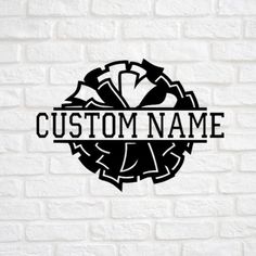 custom name sticker on a white brick wall