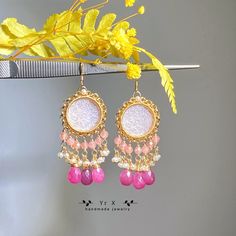 ♢ FEATURES & MATERIALS ~Cameo:pink mother of pearl,natural color,hand carved,15mm ~Pink Sapphire: natural color,9-10mm ~Rhodochrosite:natural color,3mm ~Pearl:natural color,2-3mm ~Materials: 14K Gold Filled This pair of gorgeous pink mother-of-pearl Cameos are hand-carved with vintage patterns. I paired them with pink sapphire droplets, rhodochrosite and freshwater pearls, which are exquisite and retro. All metals are filled with 14K gold filled and will not cause skin irritation. Length of earr Pink Dangle Chandelier Earrings As Gift, Elegant Pink Round Chandelier Earrings, Pink Teardrop Chandelier Earrings For Gift, Pink Chandelier Drop Earrings For Gift, Pink Chandelier Earrings For Gift, Pink Round Chandelier Earrings For Wedding, Pink Chandelier Earrings For Wedding, Pink Earrings For Mother's Day Party, Pink Bohemian Chandelier Earrings For Party