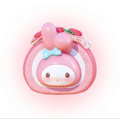 a pink toy with a bow on it's head