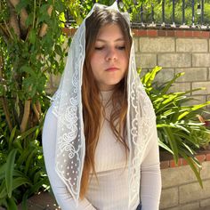 Elevate your collection with our stunning lady's veil, available in both black and white fabric. This versatile veil combines classic elegance with modern flair, featuring intricate lace detailing and a smooth, flowing design that enhances any ensemble, ideal for all kind of religious events. it adds a touch of sophistication and can seamlessly complement a range of basic and formal attire. NOTE: Wash by hand only, lay flat to dry. Measurements: 48″ x 24″ MOQ: 2 pieces Fitted Headscarf For Wedding, White Headscarf For Wedding, Elegant Wedding Headscarf, White Miraculous Medal Necklace For Wedding, Elegant White Headscarf For Wedding, Wedding Veil With Lace Work, Elegant Fitted Wedding Headscarf, Elegant Fitted Veil With Lace Trim, Elegant White Wedding Headscarf