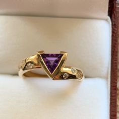 Nwot 14ky Genuine 6mm Trillion Bezel Set Amethyst With .12ctw Of Diamonds That Are Drill Set On Sides Of The Band. The Band Width Measures 4mm, Size 7 Purple Gemstone Diamond Ring In 14k Gold, Purple Diamond Ring In 14k Gold, Fine Jewelry 14k Gold Purple Diamond Ring, 14k Gold Purple Diamond Ring, Luxury Purple Amethyst 14k Gold Ring, Yellow Gold Amethyst Ring With Accent Stones, Round Cut, Yellow Gold Amethyst Ring With Round Cut Accent Stones, Fine Jewelry Yellow Gold Amethyst Ring With Accent Stones, Diamond Amethyst Ring In Yellow Gold For Anniversary