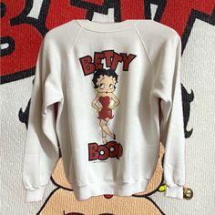 Vintage Authentic Betty Boop Sweatshirt Year Of 1988 Double Sided Graphic Color White Size Large Condition Is Used And Clean Measurements: P2p - 21” Length - 24.5” Flaws: Small Staining Under Front Graphic Sweaters Vintage, Betty Boop, Red And White, Scoop Neck, Double Sided, Color White, Sweaters For Women, Sweatshirts, Red