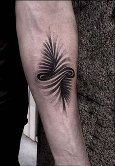 a person with a tattoo on their arm that has an image of a wave coming out of it