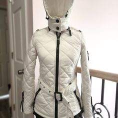 White Quilted Puffer Jacket By Burberry London. Detachable Hood With Adjustable . Long Sleeves. Zip-Front Closure. Adjustable Belted Waist. Antiqued Black Hardware. . Pockets Logo On All The Zippers Condition: Pre-Owned. Very Good. Est. Retail $ 995.00 It Says Us 6 But Fits Like At 2 If You Want To Zipper Up. Otherwise Open Can Fit A 4 Fitted Winter White Outerwear With Detachable Hood, White Fitted Quilted Jacket For Fall, Fitted White Quilted Jacket With Long Sleeves, White Quilted Fitted Outerwear, Fitted Quilted White Outerwear, White Fitted Quilted Outerwear, Fitted White Quilted Outerwear, Designer Fitted White Outerwear, Designer White Fitted Outerwear