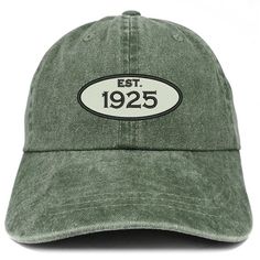 a green hat with the words est 1939 printed on it's front and back