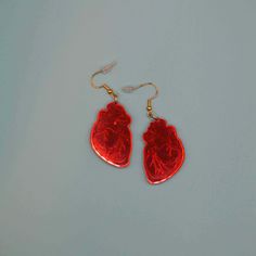 These anatomical heart earrings are cut from red mirror acrylic that is reflective red on the front and muted silver on the back. They attach with a sterling silver, hypoallergenic earring wire hook. Red Mirror, Anatomical Heart, Hypoallergenic Earrings, Heart Earrings, Mirror, Sterling Silver, Red, Silver