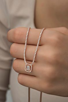 White Zircon Stone Waterway Silver Necklace ♥ ✔️Metal Used: 925 Sterling Silver ✔️Weight : 7,40 Gr ✔️Figure Width: 1,00 Cm ✔️Figure Height: 1,20 Cm ✔️Chain Length : 42+3 Cm ✔️Stone Type : Zircon ✔️Coating : Rose Gold Plated ⚠️Care: It does not darken as long as contact with substances such as Perfume, Water, Alcohol, Cream, Bleach is avoided. -NRZ998437 Octagon Necklace For Wedding, Rose Gold Necklaces With Baguette Diamonds, Rose Gold Emerald Cut Jewelry With Baguette Diamonds, Rose Gold Emerald-cut Jewelry With Baguette Diamonds, Rose Gold Emerald-cut Baguette Diamond Jewelry, Rose Gold Baguette Cut Necklace For Gift, Rectangular Rose Gold Jewelry With Baguette Diamonds, Rose Gold Baguette Cut Jewelry Gift, Octagon Baguette Diamond Jewelry Gift