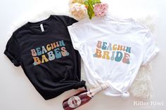 two t - shirts with the words bride and babe on them sitting next to each other