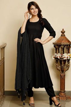 Buy Jet black solid flared kurta with gold dot dupatta Online Black Cotton Kurta With Traditional Drape, Black Anarkali Set With Straight Kurta, Traditional Black Cotton Kurta, Black Chanderi Anarkali Set With Traditional Drape, Black Kurta With Sheer Dupatta For Navratri, Black Anarkali Set For Diwali, Navratri Black Kurta With Sheer Dupatta, Designer Black Cotton Churidar, Black Chanderi Anarkali Dupatta