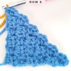 the crochet triangle is being worked on