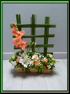 a basket filled with flowers sitting on top of a table