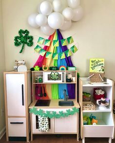 a child's play room with balloons and decorations