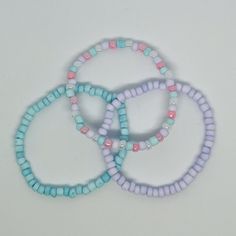 Cute, pastel bracelet stack which is great for friendship bracelets, party favors, or summer fun. The bracelets can also be purchased as Mom and Me matching sets. A stack includes all 3 bracelets or bracelets can be purchased individually. Bracelets are handmade with glass seed beads and extra stretchy cording. Sizing: IF you are unsure, it's always best to size up. XX Small - The XX Small, 6". Are perfect for the tiniest of wrists, children 4-7. Not recommended for children under 4. X Small - The X Small, 6.5", are perfect for children 6-11. Not recommended for children under 4. Small - A few designs are available in small, 7", which are recommend for teens and young adults with small wrists. Medium - The medium bracelet, 7.25", fits most adult women's wrists. Shipping:  Processing time i Pastel Bracelet, Girls Bracelet, Pastel Girl, Mom And Me, Cute Pastel, Bracelet Beaded, Bracelet Stack, Friendship Bracelet, Party Favor