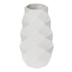 The Mainstays 11.14" Tall White Geometric Ceramic Vase will add the perfect finishing touch to your space. Featuring a textured geometric design, this decorative ceramic vase makes for a beautiful accent piece on a mantle, console table, or shelf. Its large round opening makes it perfect for displaying artificial floral inside. The solid white color will allow this piece to blend with any décor. The Mainstays 11.14" Tall White Geometric Ceramic Vase Geometric design gives it a modern look White color will look great with any décor For use with artificial floral Crafted of durable ceramic material Item dimensions are 6.1" L x 6.1" W x 11.14" H Paper Flower Vase, Clear Vases, White Ceramic Vases, Vase Shapes, Home Decor Vases, Vase Centerpieces, White Vases, Arte Animal, Beautiful Vase