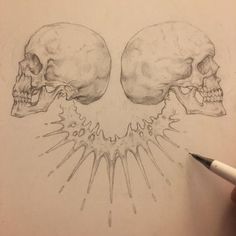 a drawing of two skulls with their heads turned to the side, and one being drawn in pencil