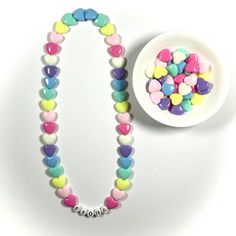 "You have just found the perfect gift for birthdays or Easter! This cute pastel, retro HEART necklace can come personalized or with hearts only. This 16\" stretchy necklace fits right over your head so it's easy to put on- no clasps needed. The matching bracelet is listed here: https://www.etsy.com/listing/909362079/kids-heart-bracelet-party-favor-girls?ref=shop_home_active_5&frs=1 Please check all selections and spelling prior to check out. Our custom jewelry is made to order so all sales a Bracelet Party, Retro Heart, Girls Necklace, Jewelry For Girls, Necklace Cute, Matching Bracelet, Name Jewelry, Birthday Gifts For Kids, Girls Necklaces