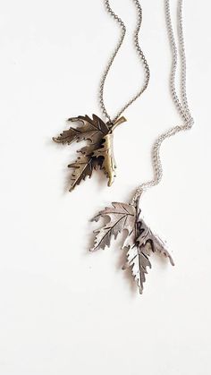 Statement Leaf Necklace, perfect for nature lovers in silver or bronze finish { D e s c r i p t i o n } The centerpiece of the necklace is a Canadian maple leaf pendant, which is known for its iconic and recognizable shape. The pendant is beautifully crafted with attention to detail, with every vein of the leaf captured.  The pendant is available in either a silver or bronze finish, allowing you to choose the color that best complements your personal style. The chain closes with a lobster clasp and is just the right length to sit comfortably against your chest. Great to wear over knits, thick blouses in autumn and winter. Also works amazingly with long bohemian dresses.  Whether you are looking for a piece of jewelry to wear for a special occasion, or you simply want to treat yourself to s Nature-inspired Silver Jewelry With Adjustable Chain, Nature-inspired Silver Metal Necklace, Nature-inspired Silver Brass Necklaces, Nature-inspired Silver Brass Necklace, Nature-inspired Silver Brass Jewelry, Nature-inspired Metal Jewelry With Oxidized Finish, Jewelry Rustic, Boho Nature, Bohemian Dresses Long