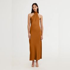 The Darcy Backless Dress In Caramel Is Perfect For Your Events This Season. Collared Neckline, Button Closure And Plunging Backline For A Feminine Finish. Perfect For Bridesmaids, Pair With A Simple Heel For A Complete Look. Elegant Brown Halter Neck Maxi Dress, Elegant Brown Halter Neck Dress, Spring Camel Dress, Flowy Floral Dress, Navy And White Dress, Green Velvet Dress, Floral Halter Dress, Velour Dress, Satin Long Sleeve