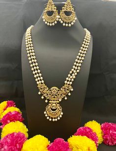 Embrace the cultural opulence of Long Rani Haram Set with Pearls, where each set is a work of art. Whether you're attending weddings, cultural events, celebrating important occasions, or simply seeking to add a meaningful touch to your attire, this necklace promises to adorn you with grace and the timeless charm of traditional jewelry. Elevate your style with cultural flair - order yours now! Here are some of the best ways to care for your artificial jewelry: *Keep it dry away and from moisture. White Temple Jewelry Sets With Intricate Design, Elegant White Jewelry For Navratri, Festive White Jewelry Sets, White Kundan Necklace With Intricate Design For Celebration, Wedding Jewelry Beaded For Navratri, Wedding Jewelry With Beads For Navratri, Beaded Jewelry For Navratri Wedding, White Temple Jewelry Sets For Festive Occasions, Beaded Jewelry For Wedding And Navratri