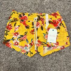 April Kiss Linen Beach Shorts Floral Pattern On Mustard Yellow Background. Have A Drawstring 2” Inseam Flat Nwt Size Small Yellow Shorts For Beachwear, Yellow Beach Shorts, Yellow Swimwear With Built-in Shorts For Poolside, Playful Yellow Summer Shorts, Yellow Beach Shorts With Built-in Lining, Lululemon Hotty Hot Shorts, Hotty Hot Shorts, Celebrity Pink, Stretch Denim Shorts