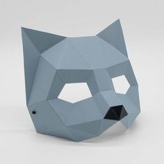 an origami cat mask made out of paper