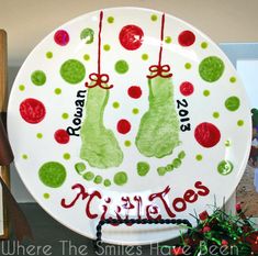 a white plate with green and red christmas stockings on it