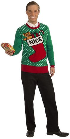 a man in an ugly christmas sweater holding a hot dog