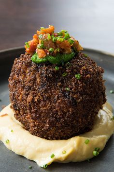 a black plate with some food on top of it