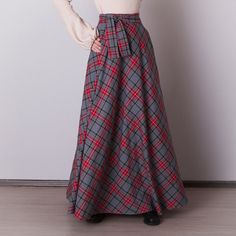 Gray plaid skirt: - Side seam pockets - Hidden zipper in the side seam - Separate sash - Classic tartan pattern - Fabric is 40% wool, 58% polyviscose, 2% of elastane Model is 6'2'', she wears US 8 size US 0  Bust 82 cm (32.5 inches) Waist 64 cm (25 inches) Hips 89 cm (35 inches) US 2  Bust 85 cm (33.5 inches) Waist 66 cm (26 inches) Hips 92 cm (36 inches) US 4  Bust 88 cm (34.5 inches) Waist 68 cm (27 inches) Hips 94 cm (37 inches)  US 6  Bust 90 cm (35.5 inches) Waist 71 cm (28 inches) Hips 96 cm (38 inches)  US 8  Bust 93 cm (36.5 inches) Waist 74 cm (29 inches) Hips 99 cm (39 inches) US 10  Bust 95 cm (37.5 inches) Waist 76 cm (30 inches) Hips 102 cm (40 inches) US 12  Bust 99 cm (39 inches) Waist 80 cm (31.5 inches) Hips 105 cm (41.5 inches) US 14  Bust 103 cm (40.5 inches) Waist 84 cm Plaid Skirt With Pockets For Winter, Scottish Plaid Skirt For Winter, Winter Scottish Plaid Skirt, Plaid Skirt With Pockets, Scottish Style Plaid Winter Bottoms, Gray Plaid Skirt, Grey Plaid Skirt, Plaid Maxi Skirt, Tartan Skirt