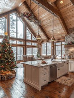 a large kitchen with a christmas tree in the center