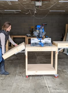 a woman is working on a project in a garage with workbench and tools