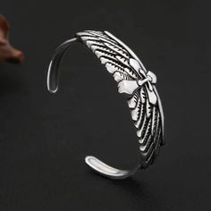 Vintage Fashion Stainless Steel Eagle Wings Bracelet Discover the perfect accessory for expressing your unique style with our Vintage Fashion Stainless Steel Eagle Wings Bracelet. This trendy charm bracelet is designed for both men and women, making it a versatile addition to any jewelry collection. Specifications Gender: Unisex Metals Type: Stainless Steel Fine or Fashion: Fashion Style: Punk Material: Metal Shape/Pattern: Cross Detail Packing: Jewelry Bag Metal: 316L Stainless Steel Durability Spiritual Freedom, Eagle Wings, Casual Rings, Punk Accessories, Vintage Fine Jewelry, Choker Pendant, Gold Diamond Earrings, Men Earrings, Cross Jewelry