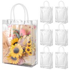 six clear plastic bags with sunflowers and flowers in them on a white background