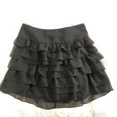 Super Cute Black Ruffle Skirt! Style With A Pair Of Black Heels For Those Girl’s Nights Out! Sits In The Hips. New With Tags. Size 04 #Ruffles #Skirts #Gno #Express Black Ruffled Skirt, Black Lace Mini Skirt, Black Ruffle Skirt, Distressed Jean Skirt, Butterfly Skirt, Purple Skirt, Suede Mini Skirt, Floral Mini Skirt, Sequin Mini Skirts