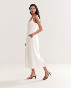 With a silhouette that’s equally flattering and elevated, the Rove Dress is designed to breathe new life into any summer ensemble. Fitted bust with pencil-skirt that hits below the calf, the Rove Dress is destined to be a spring & summer staple. Lined Bodice Sundress Midi Length, Spring Midi-length Lined Slip Dress, Chic Midi Dress With Lined Bodice For Daywear, White Midi Dress With Lined Bodice And Straight Neckline, Sundress With Lined Bodice, Midi Length, Flowy Midi Dress With Straight Neckline For Summer, Feminine Summer Midi Dress With Lined Bodice, Feminine Lined Bodice Midi Dress For Summer, Chic Dresses With Flowy Fit And Straight Neckline